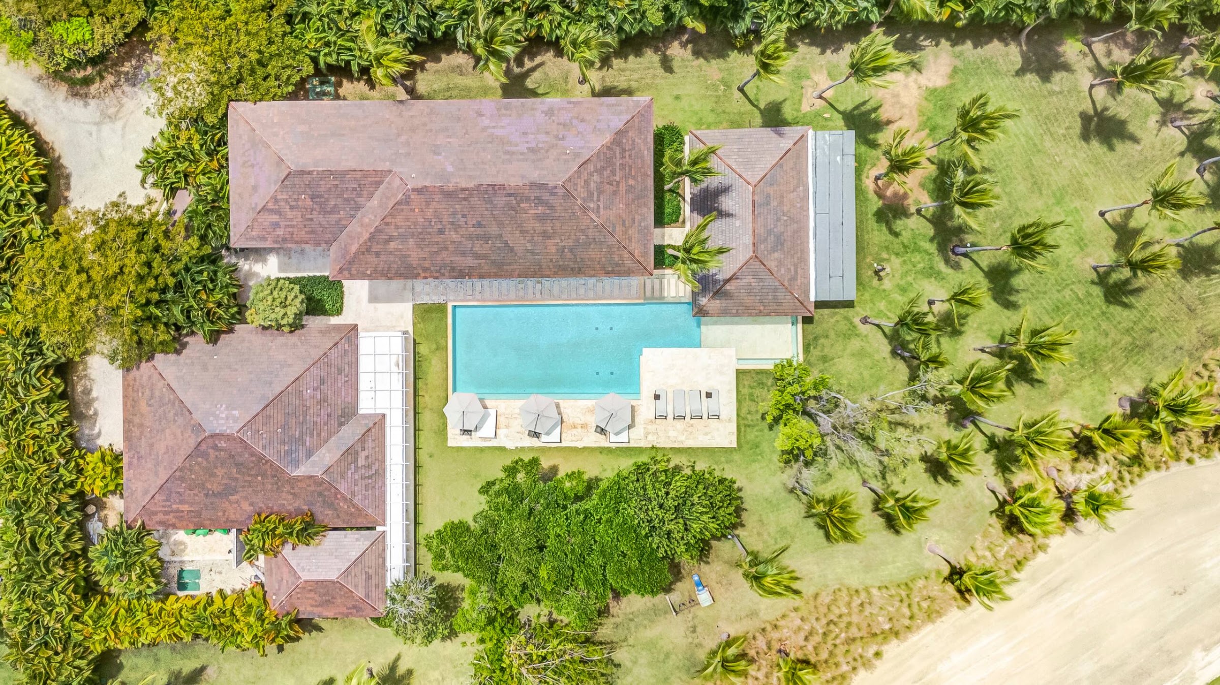 Overhead view of the villa roofs and pool