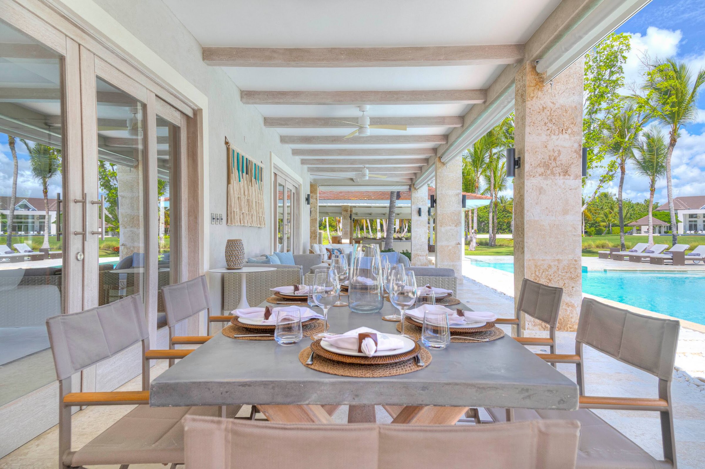 Long table set beside the water