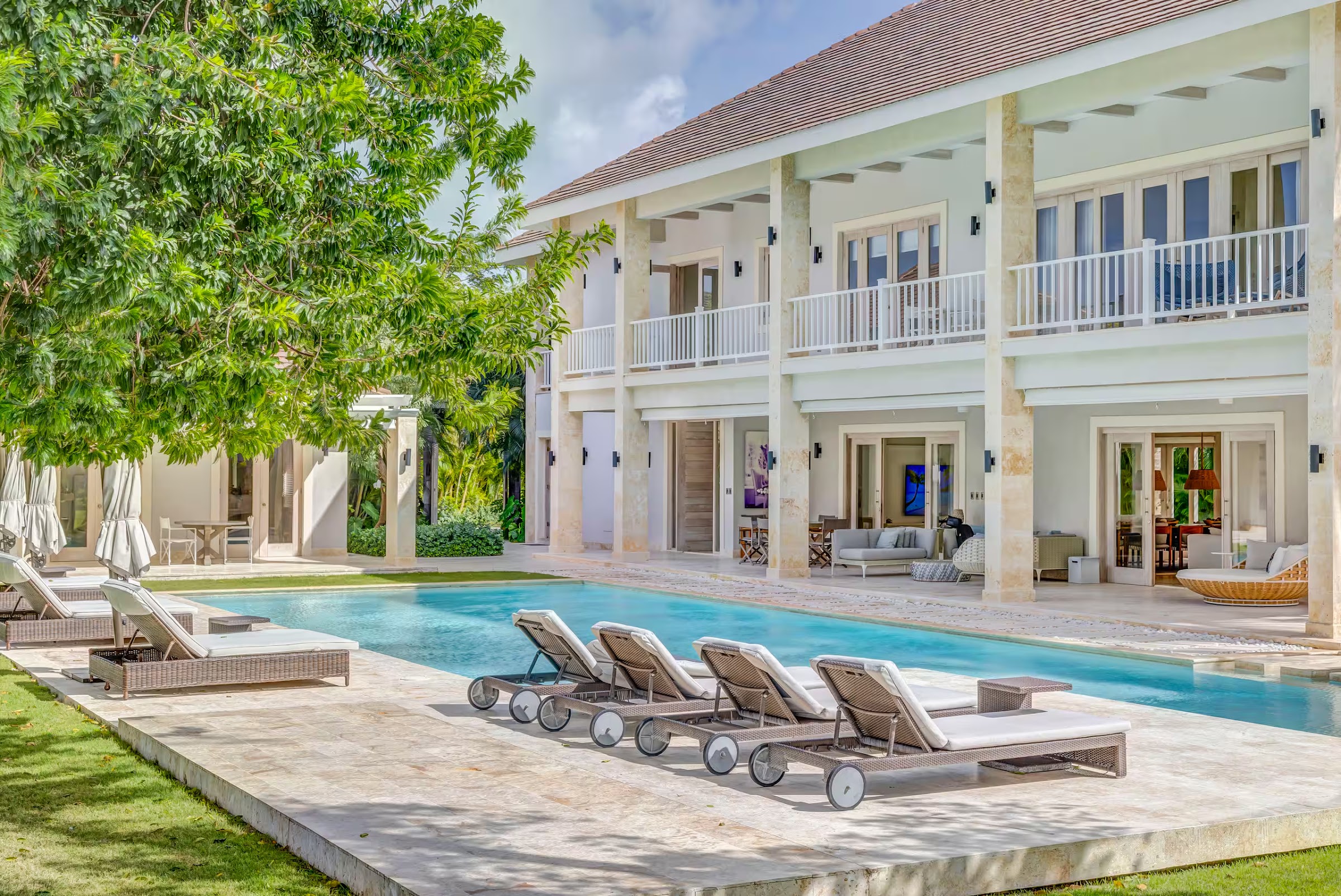 Loungers along the villa pool
